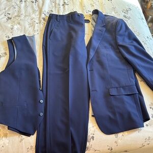 BRAND NEW blue suit